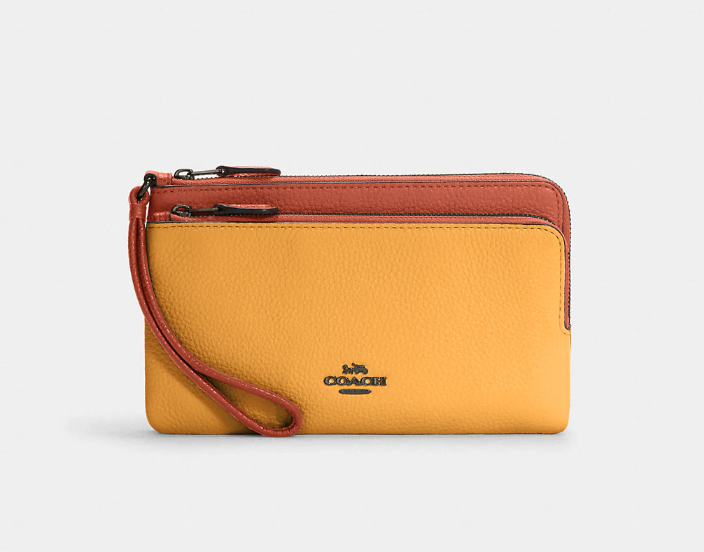 Double Zip Wallet In Colorblock. Image via Coach Outlet.