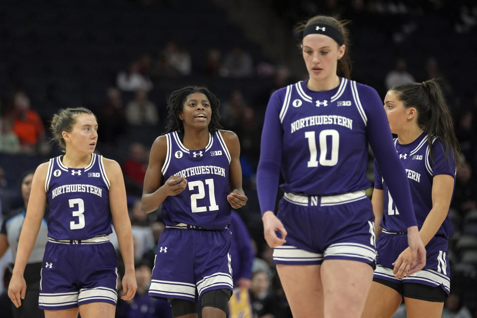 Northwestern guards Maggie Pina (3), Melannie Daley (21), forward Caileigh Walsh (10) and guard Casey Harter walk down the court during the second half of an NCAA college basketball game against Purdue at the Big Ten women's tournament Wednesday, March 6, 2024, in Minneapolis. (AP Photo/Abbie Parr)