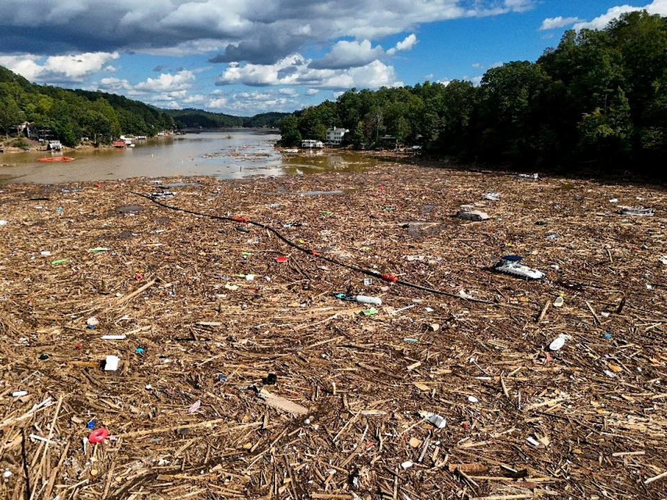 Debris is strewn on North Carolina’s  Lake Lure in the aftermath of Hurricane Helene. The storm is now the deadliest since Hurricane Katrina in August 2005 ((AP Photo/Mike Stewart))