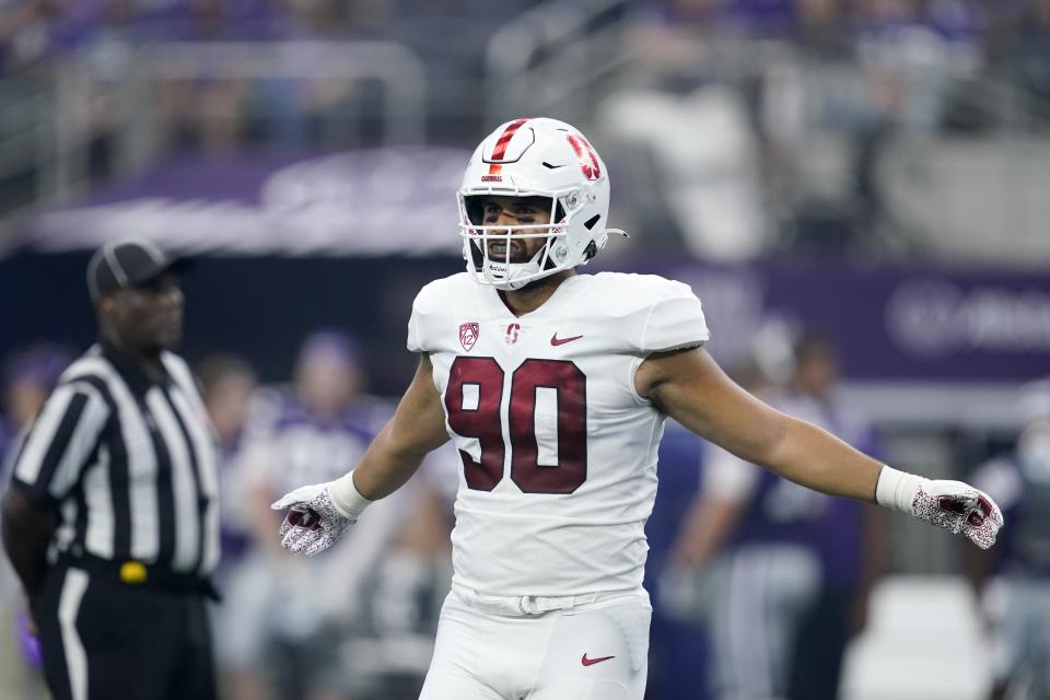 Stanford linebacker Gabe Reid (90) lines up against Kansas State during an NCAA college football game in Arlington, Texas, Sept. 4, 2021. Stanford has embraced bringing in players such as Reid after their two-year Mormon missions, valuing their life experience. (AP Photo/Tony Gutierrez, File)