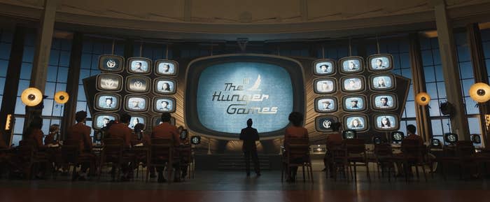 A TV displays "The Hunger Games"