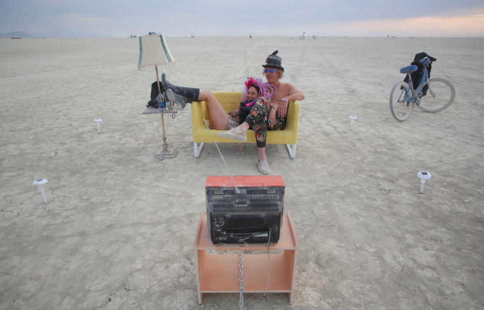 <p>Jody Friedman and Jeff Montgomery infront of the Playa TV as approximately 70,000 people from all over the world gather for the 30th annual Burning Man arts and music festival in the Black Rock Desert of Nevada, Aug. 30, 2016. (REUTERS/Jim Urquhart)</p>