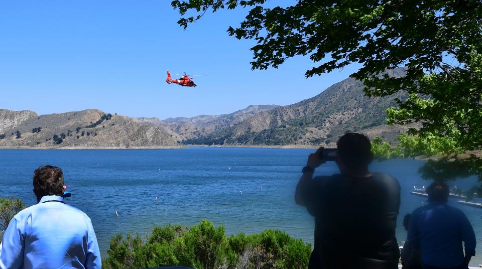 A helicopter searches over Lake Piru in Ventura County, California on July 9, 2020 for former Glee actress Naya Rivera, who was reported missing after going boating with her son on July 8. - 