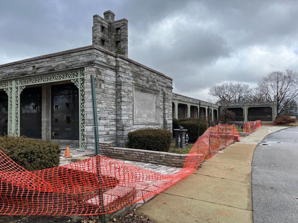 Workers put orange plastic fencing around a mausoleum at Lake View Memorial Gardens in Fairview Heights last fall to keep people away while the cemetery owner assessed damages.