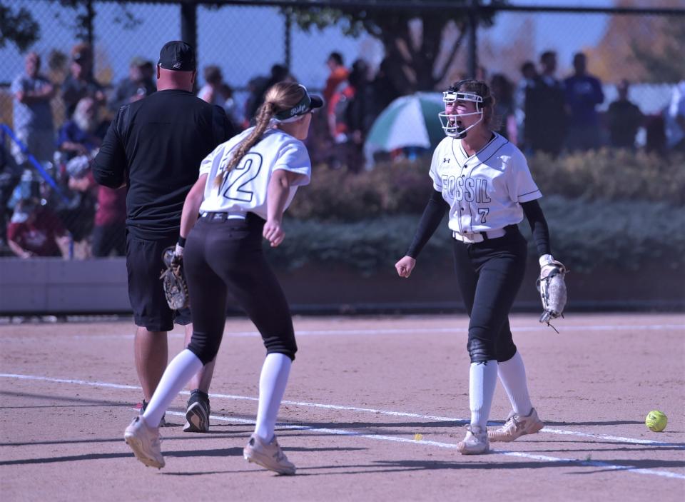 Fossil Ridge softball pitcher Brooklynn Cardenas (right) and first baseman Heidi Schneider celebrate together after the final out of the SaberCats' win over Chatfield in the Colorado 5A state softball tournament on Friday, Oct. 21, 2022 at Aurora Sports Park.