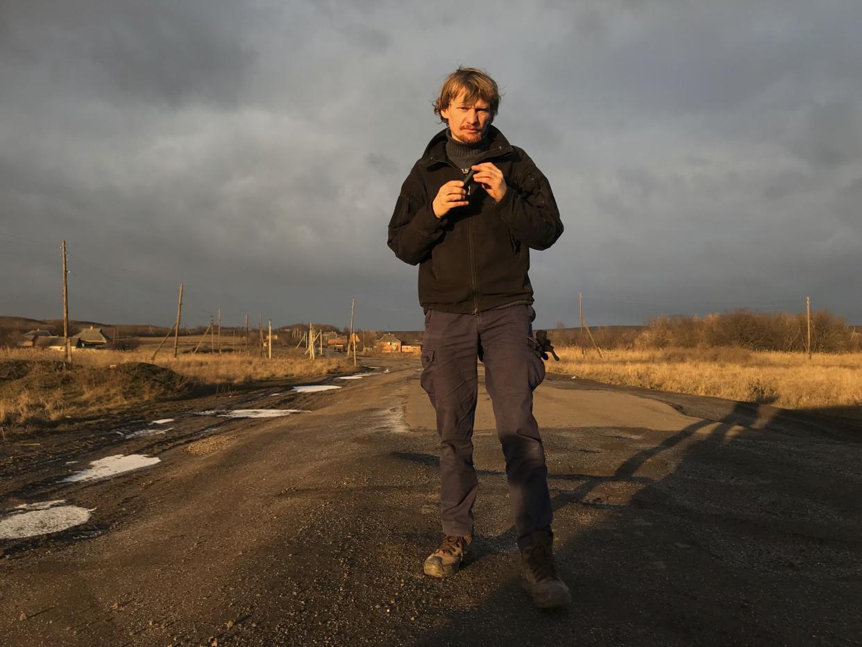 FILE - Ukrainian photojournalist Maks Levin poses for a photo in the Donetsk region in Ukraine on Jan. 12, 2018. 