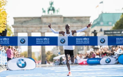 Eliud Kipchoge of Kenya crosses the finishing line to win the Berlin Marathon 2018 in a new world record time of 2:01:39 on September 16, 2018 in Berlin, Germany - Credit: Getty Images