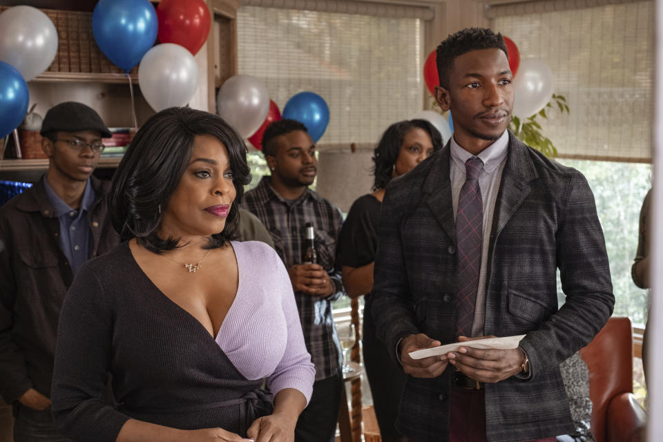This image released by Netflix shows Niecy Nash, left, and Mamoudou Athie in a scene from "Uncorked." (Nina Robinson/Netflix via AP)
