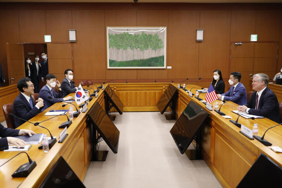 U.S. Deputy Secretary of State Stephen Biegun, right, talks with his South Korean counterpart Lee Do-hoon during their meeting at the Foreign Ministry in Seoul Wednesday, July 8, 2020. Biegun is in Seoul to hold talks with South Korean officials about allied cooperation on issues including North Korea. (Kim Hong-ji/Pool Photo via AP)