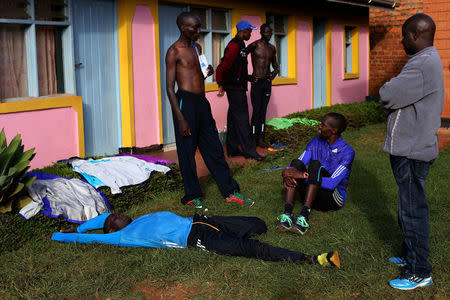 Professional athletes rest at the end of the day, just after a training session, in a training camp in Iten, western Kenya, April 12, 2016. REUTERS/Siegfried Modola