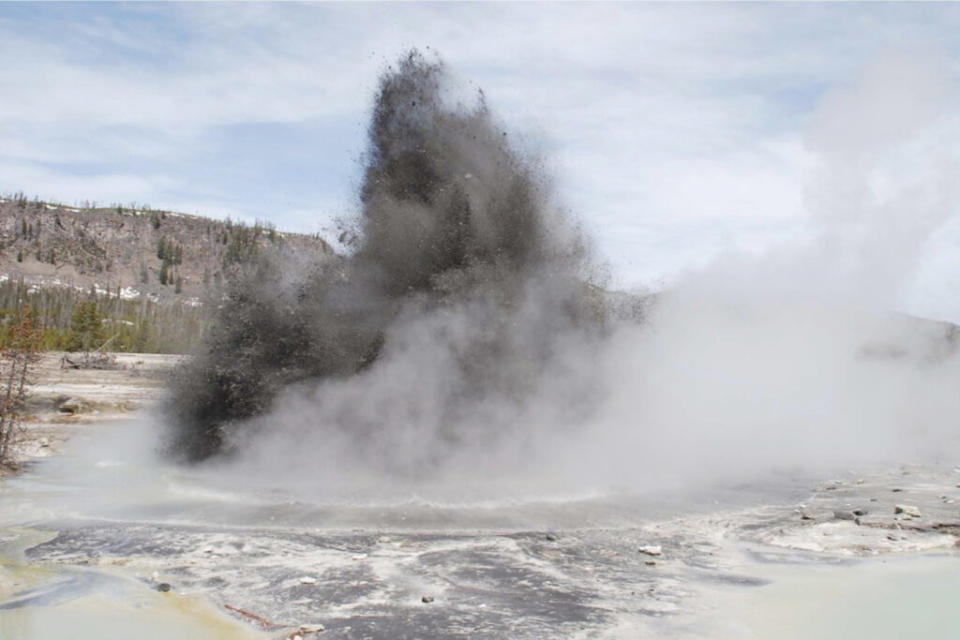  Hydrothermal explosion at Biscuit Basin in Yellowstone National Park. These types of events are the most likely explosive hazard from the Yellowstone Volcano. (Image via Public Domain / 2009 UNAVCO Earthscope Field Trip Participants)