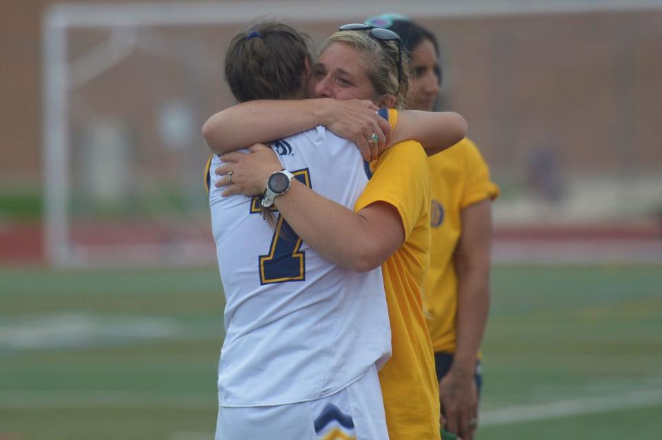 Poudre School District girls lacrosse coach Pamela Kramer hugs Maddison Santini after a 4A quarterfinal game against Green Mountain on Saturday. No. 5 Green Mountain beat No. 4 PSD 16-10.