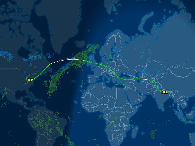 American Airlines flight path from JFK to Delhi, flying around Russia.