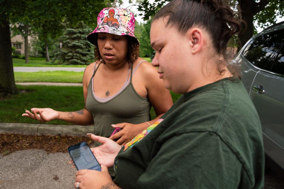 Synquiss Antes, 31, left, and Mackenzie Winton, 27, both of Lansing, talk with volunteers about areas they plan to canvass while searching for missing toddler Wynter Cole Smith, 2, outside of the Lathrup Village Police Department on Wednesday, July 5, 2023. Smith was kidnapped from her Lansing home on July 2.