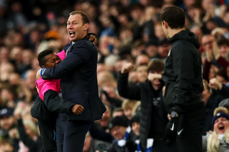 LIVERPOOL, ENGLAND - DECEMBER 07: Duncan Ferguson the interim head coach / manager of Everton celebrates with a ball boy after the second goal during the Premier League match between Everton FC and Chelsea FC at Goodison Park on December 7, 2019 in Liverpool, United Kingdom. (Photo by Robbie Jay Barratt - AMA/Getty Images)