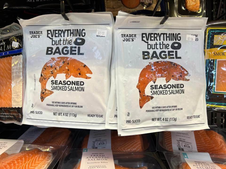 Bags of Everything But the Bagel-seasoned smoked salmon on hangers in Trader Joe's