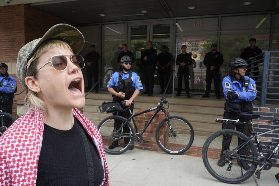 A demonstrator shouts slogans on the UCLA campus Wednesday, June 12, 2024, in Los Angeles. The president of the University of Miami has been chosen to become the next chancellor of the University of California, Los Angeles, where the retiring incumbent is leaving a campus roiled by protests against Israel's war in Gaza. (AP Photo/Damian Dovarganes)