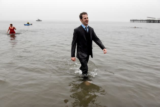 People participate in the annual Polar Bear Plunge in New York City's Coney Island on Saturday. The event returned this year after a hiatus in 2021 due to COVID-19. (Photo: Stephanie Keith/Getty Images)