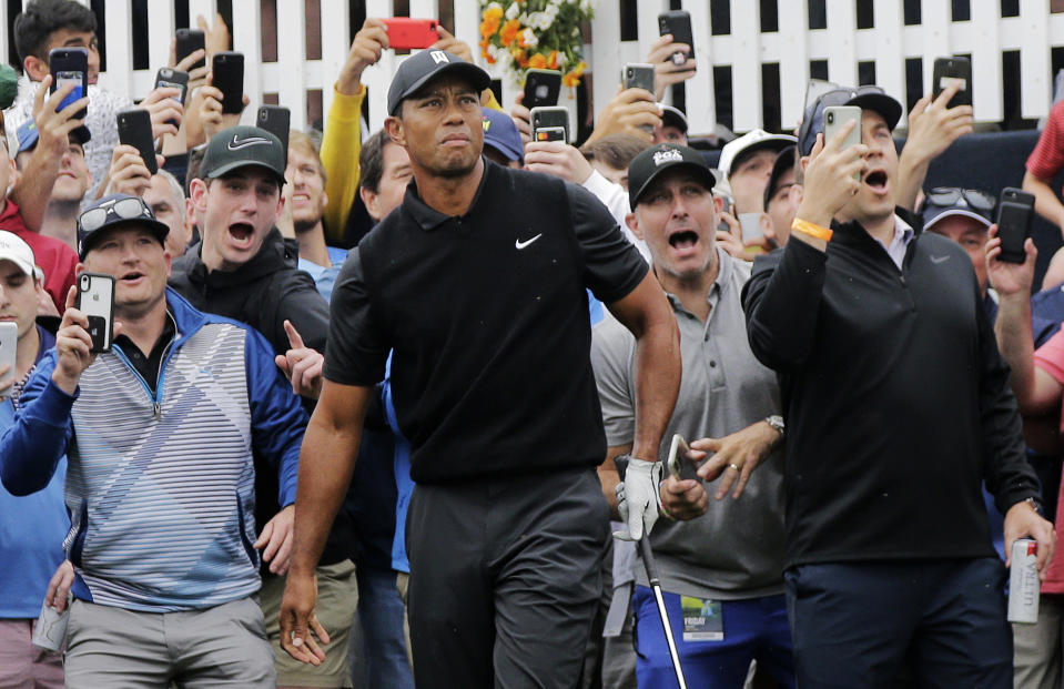 Tiger Woods watches his shot out of the rough on the first hole during the second round of the PGA Championship golf tournament, Friday, May 17, 2019, at Bethpage Black in Farmingdale, N.Y. (AP Photo/Seth Wenig)