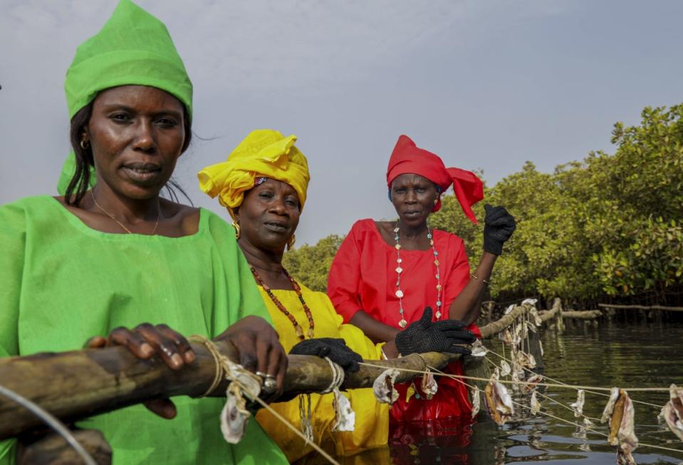 Amy in yellow on Maya Island (Ina Makosi/ActionAid)