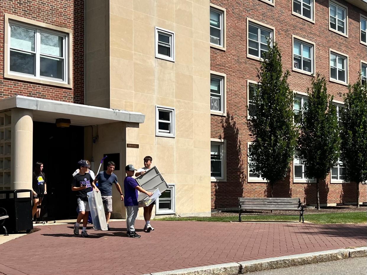 Parents help students move into Brooks Hall at the College of the Holy Cross