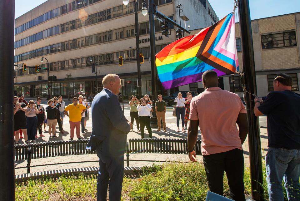 A Pride flag is raised in front of City Hall Thursday, Aug. 31, 2023.