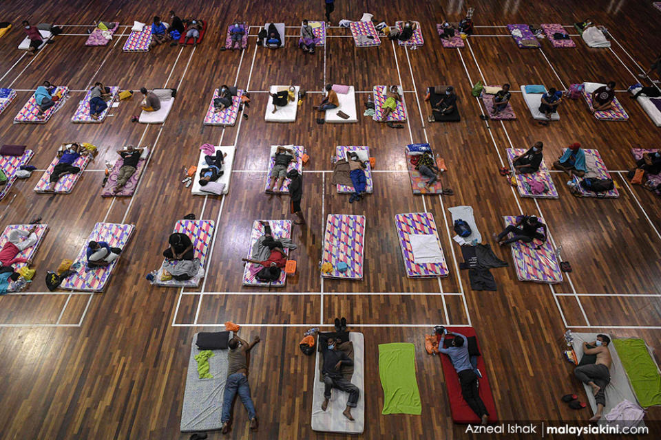 Homeless people practice social distancing on Apr 1, 2020, as they sit on their beds at a temporary shelter in KL during the MCO, which limited the activities of people in Malaysia as a preventive measure against the virus.<p><br></p>