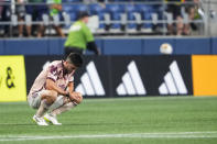 Portland Timbers defender Eric Miller squats as time expires and the team's MLS soccer match against the Seattle Sounders ends in a 2-2 draw, Saturday, Sept. 2, 2023, in Seattle. (AP Photo/Lindsey Wasson)