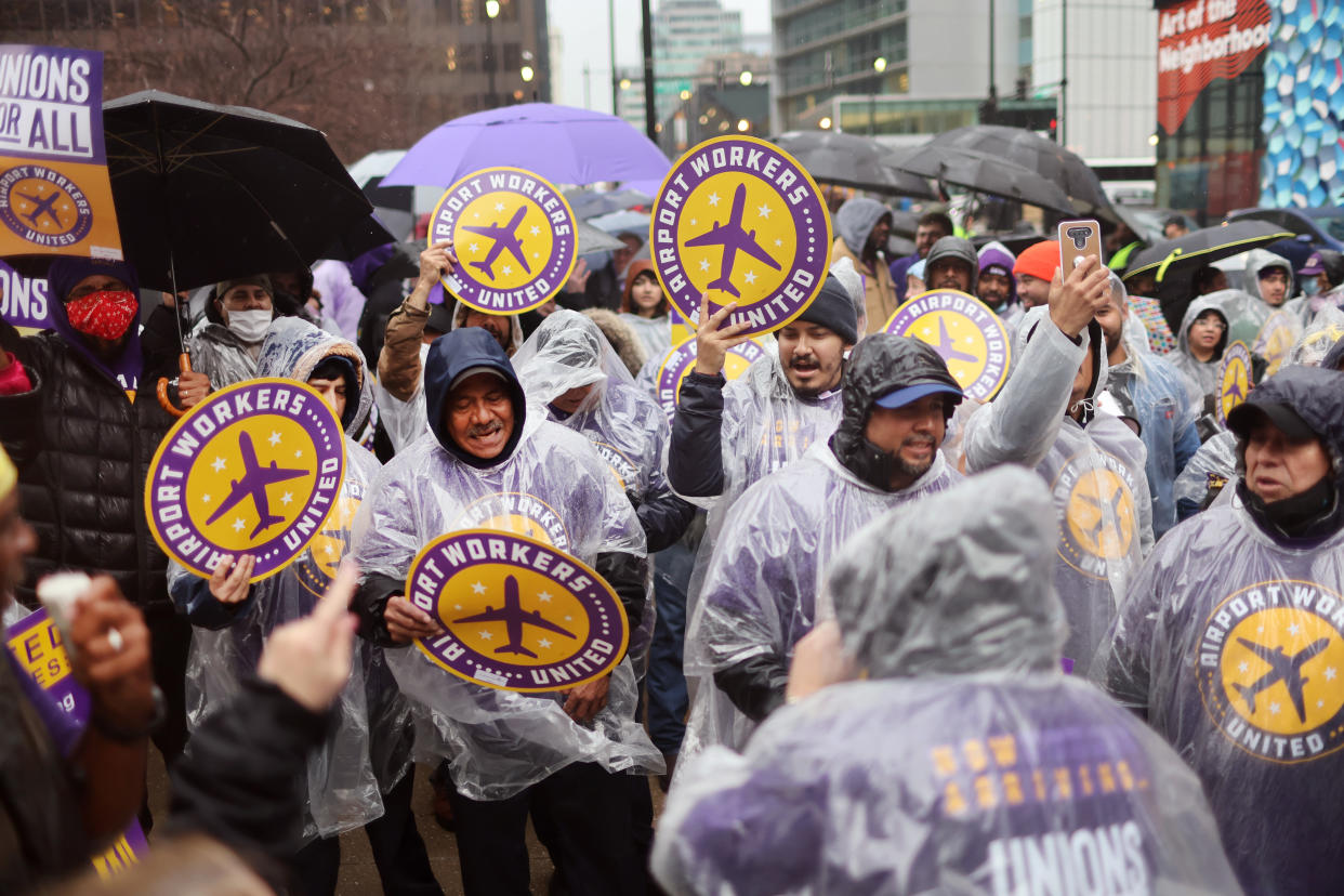 CHICAGO, ILLINOIS - MARCH 30: Airport workers participate in a rally organized by the Service Employees International Union (SEIU) outside of the Willis Tower headquarters of United Airlines on March 30, 2022 in Chicago, Illinois. The rally was held to encourage United Airlines to sign the 