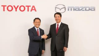 Toyota chief Akio Toyoda (left) and Mazda chief Masamichi Kogai