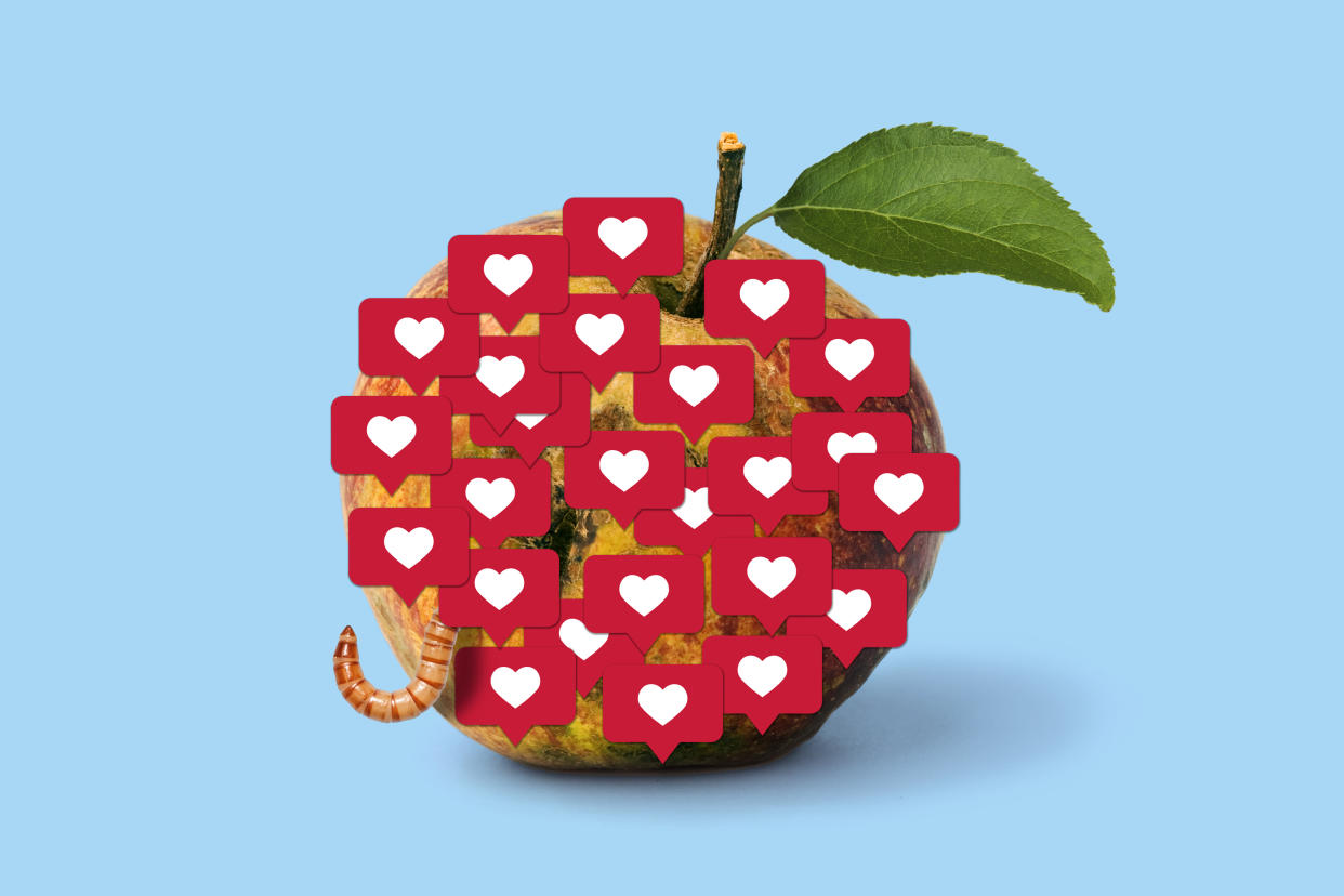 apple with a worm crawling out of it with heart text emojis superimposed on top of the fruit