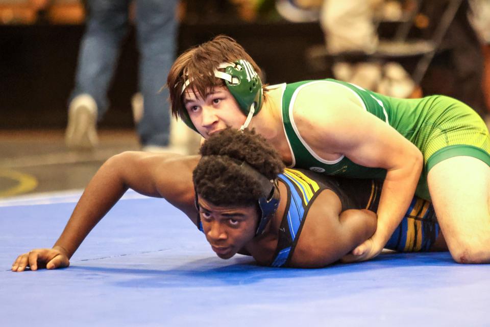 Pampa’s Colin George battles Boys Ranch’s Donte Odufuwa in a 157-pound match in the District 3-5A Wrestling Championship, February 4, 2023, at Amarillo High School, in Amarillo, Texas.  Odufuwa won by fall.