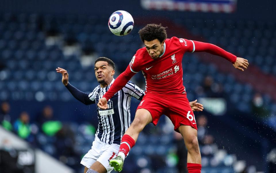 Trent Alexander-Arnold of Liverpool heads the ball - Telegraph