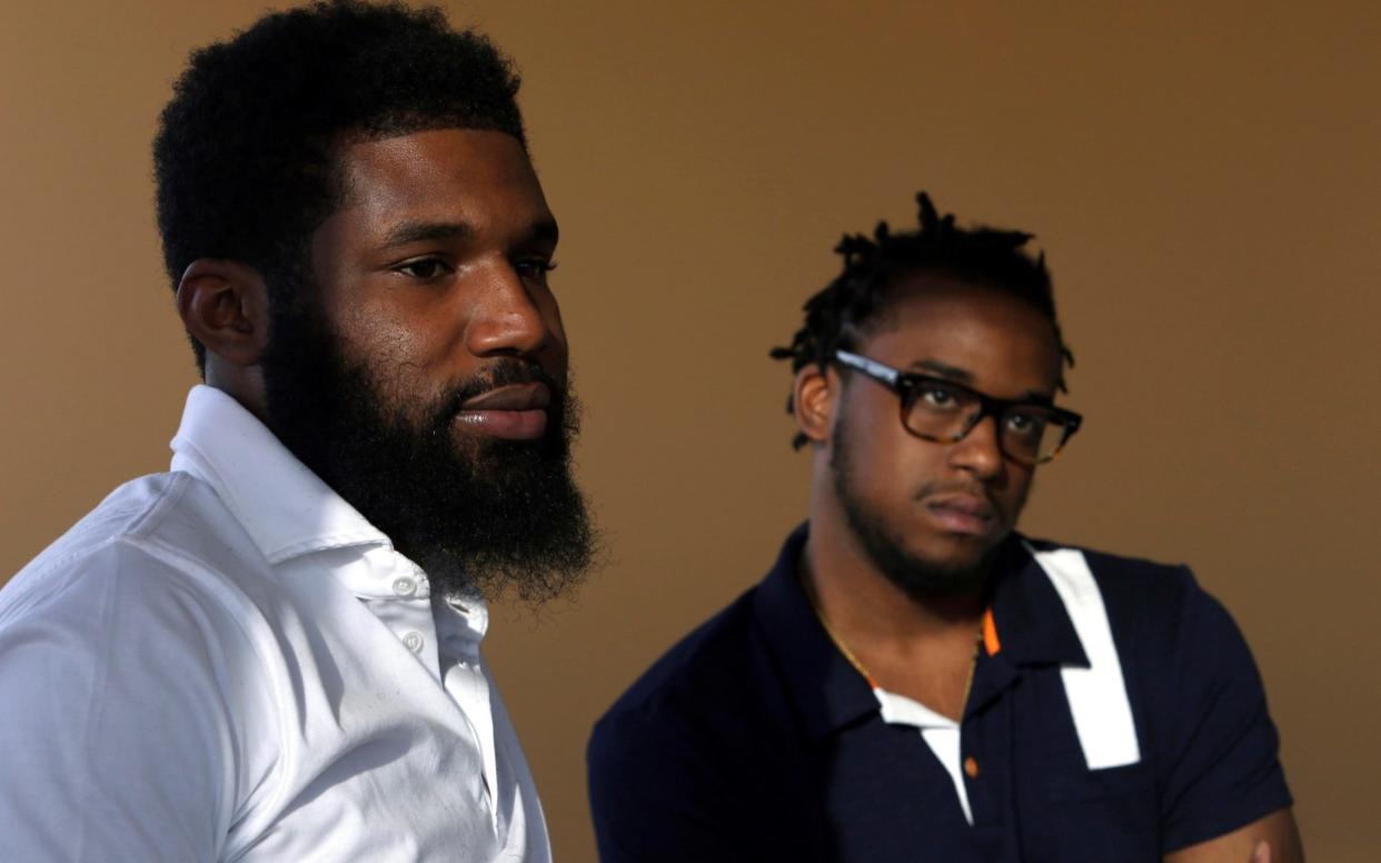 Rashon Nelson, left, and Donte Robinson, right, were arrested at a Starbucks cafe in Philadelphia - AP