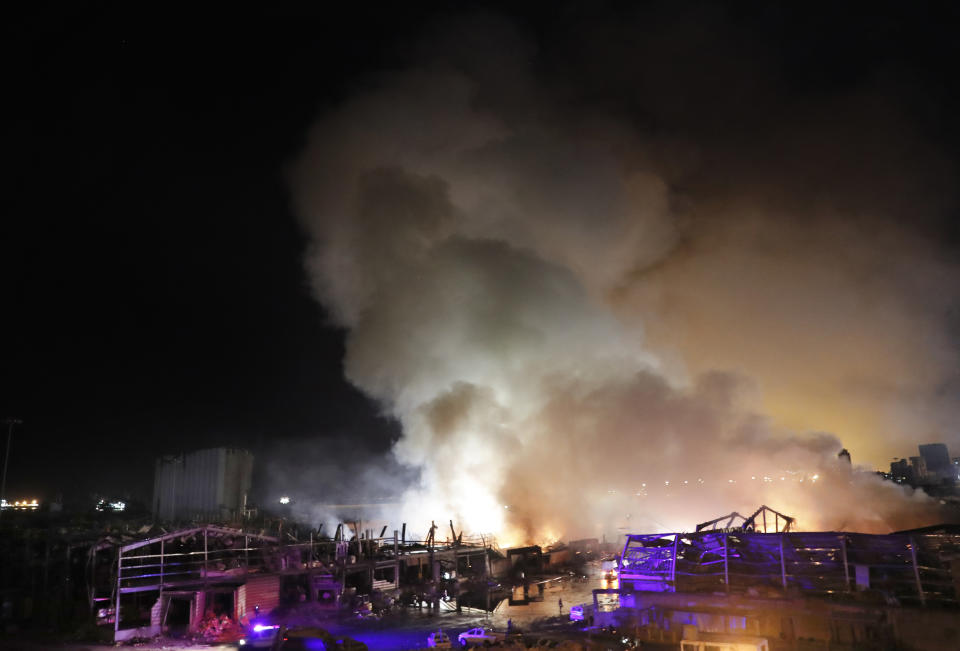 Flames and smoke rise from burning warehouses at the seaport of Beirut, Lebanon, Thursday, Sept. 10. 2020. A huge fire broke out Thursday at the Port of Beirut, triggering panic among residents traumatized by last month's massive explosion that killed and injured thousands of people. (AP Photo/Hussein Malla)