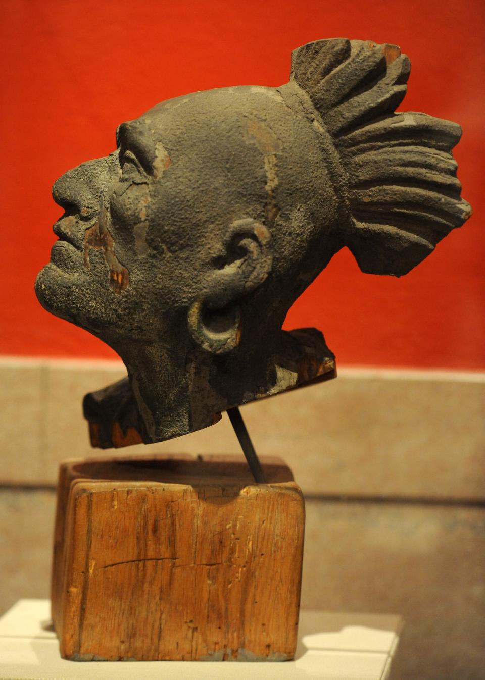 The wooden head likeness of Native American Squanto, which is the only surviving piece of the wooden pediment that was installed on the Pilgrim Hall Museum building in Plymouth, Massachusetts in 1880.