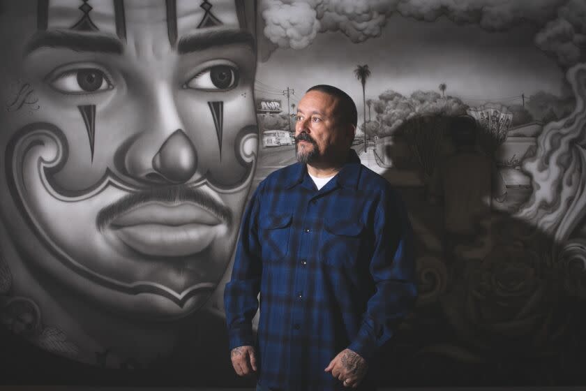 Los Angeles, CA - June 06: Mr. Cartoon poses for a portrait at Beyond the Streets Control Gallery where a gallery of his work is on display on Tuesday, June 6, 2023 in Los Angeles, CA. (Jason Armond / Los Angeles Times)