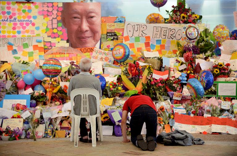 People pay their respects to Lee Kuan Yew at a tribute area at Singapore General Hospital