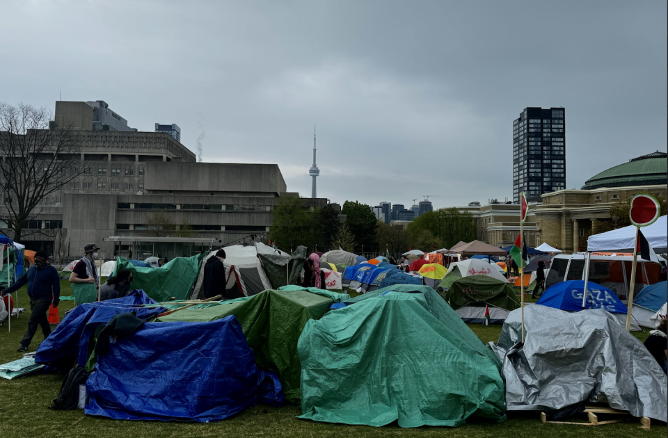 <p>Dozens of tents dot the enclosure providing shelter for students. (Credit: Corné van Hoepen)</p> 