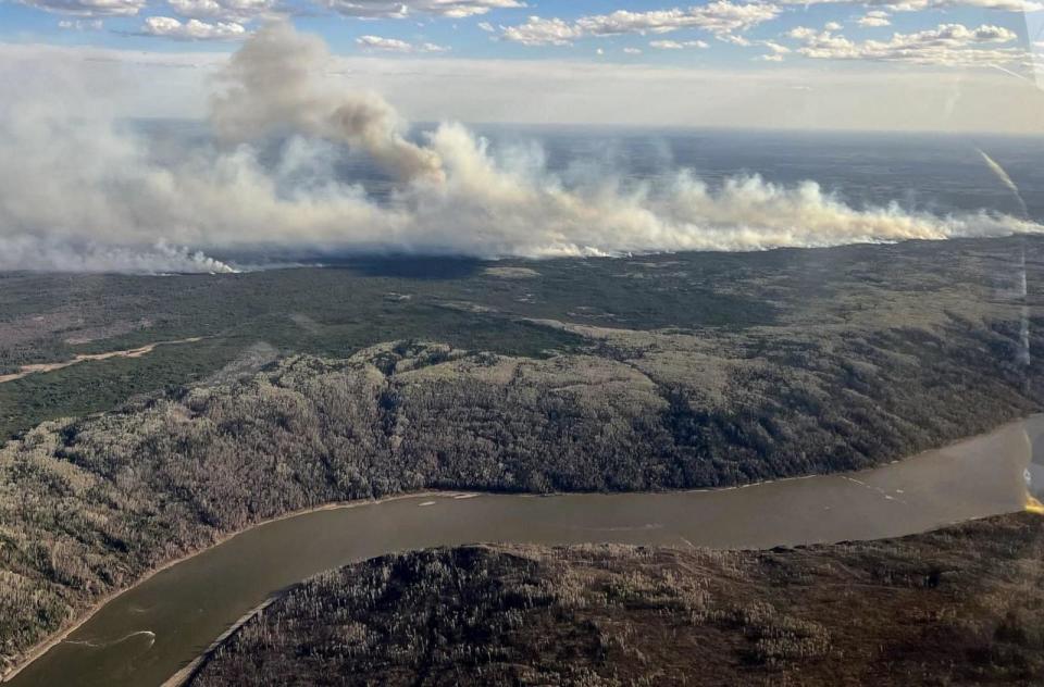 PHOTO: Smoke from wildfires burning 16km SW of the town of Fort McMurray, in Alberta, Canada is seen May 11, 2024. (Alberta Wildfire Service/AFP via Getty Images)