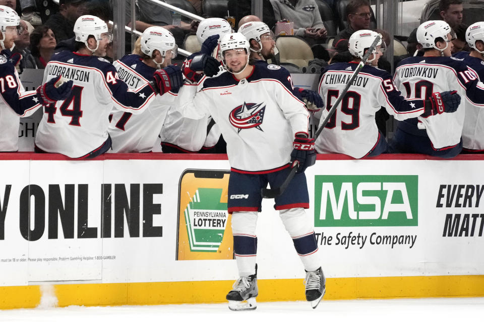 Columbus Blue Jackets' Andrew Peeke (2) returns to his bench after scoring against the Pittsburgh Penguins during the second period of an NHL hockey game Tuesday, March 5, 2024, in Pittsburgh. (AP Photo/Gene J. Puskar)