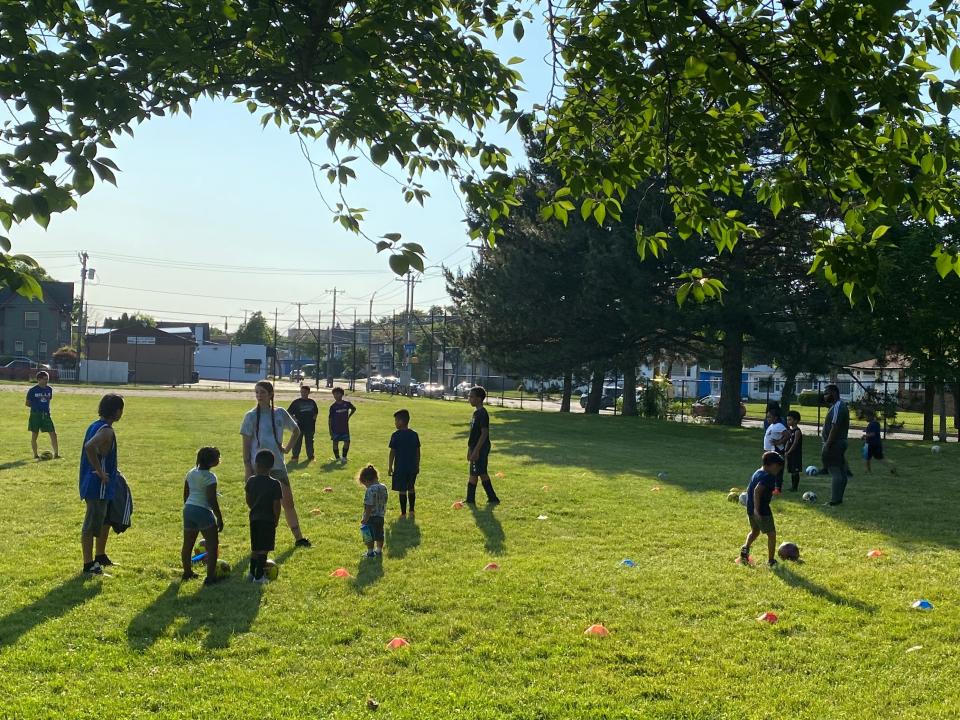 Rochester children participate in Coach Herman Escalante's soccer training program outside of Carter Street R-Center.