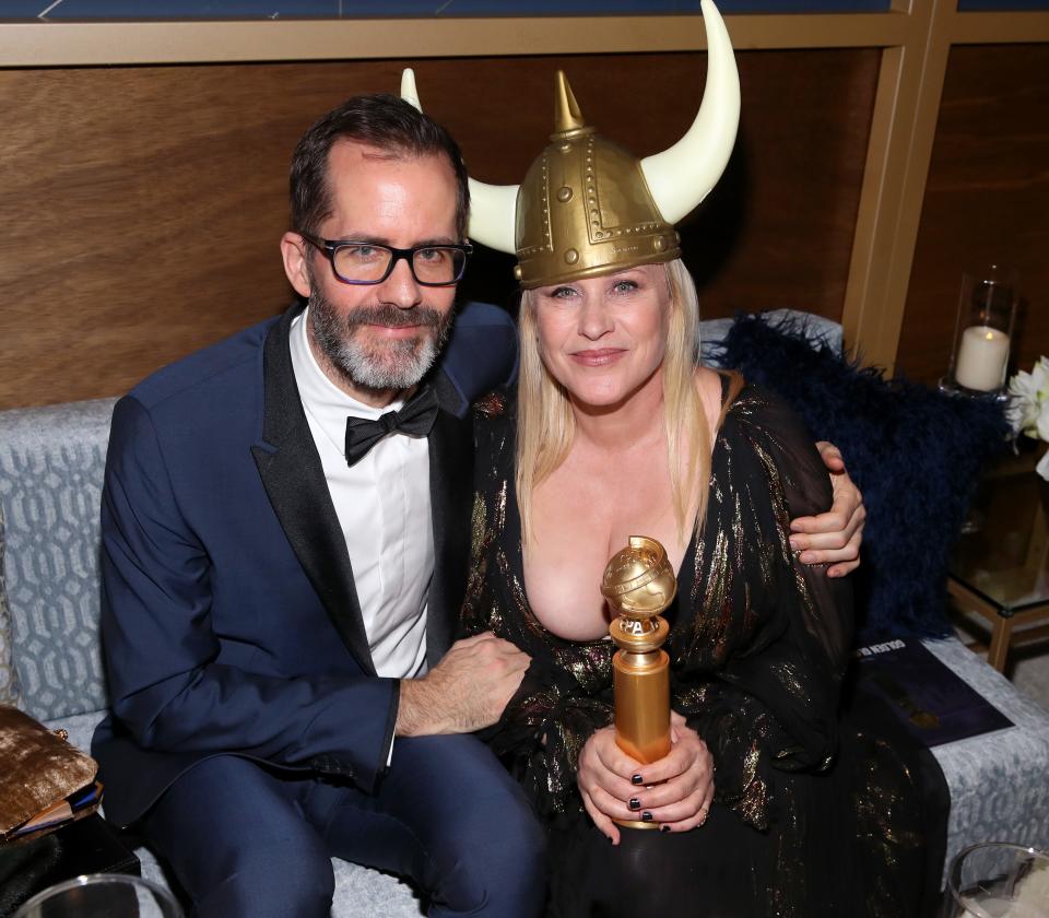 Patricia Arquette, right, got festive with Eric White at the 2020 InStyle And Warner Bros. bash.