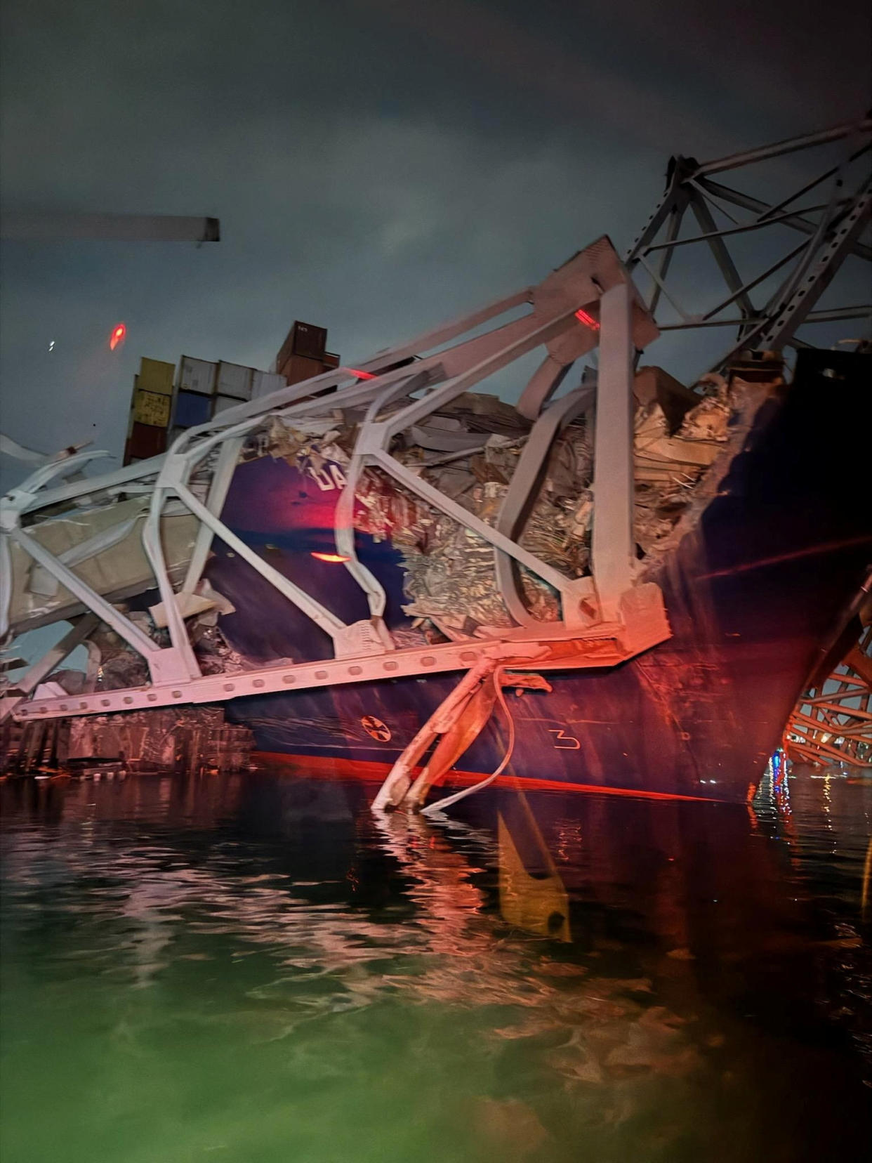 A view of the Dali cargo vessel which crashed into the Francis Scott Key Bridge causing it to collapse in Baltimore, Maryland, U.S., March 26, 2024.  BALTIMORE CITY FIRE DEPARTMENT RESCUE COMPANY/Handout via REUTERS    THIS IMAGE HAS BEEN SUPPLIED BY A THIRD PARTY. NO RESALES. NO ARCHIVES. MANDATORY CREDIT