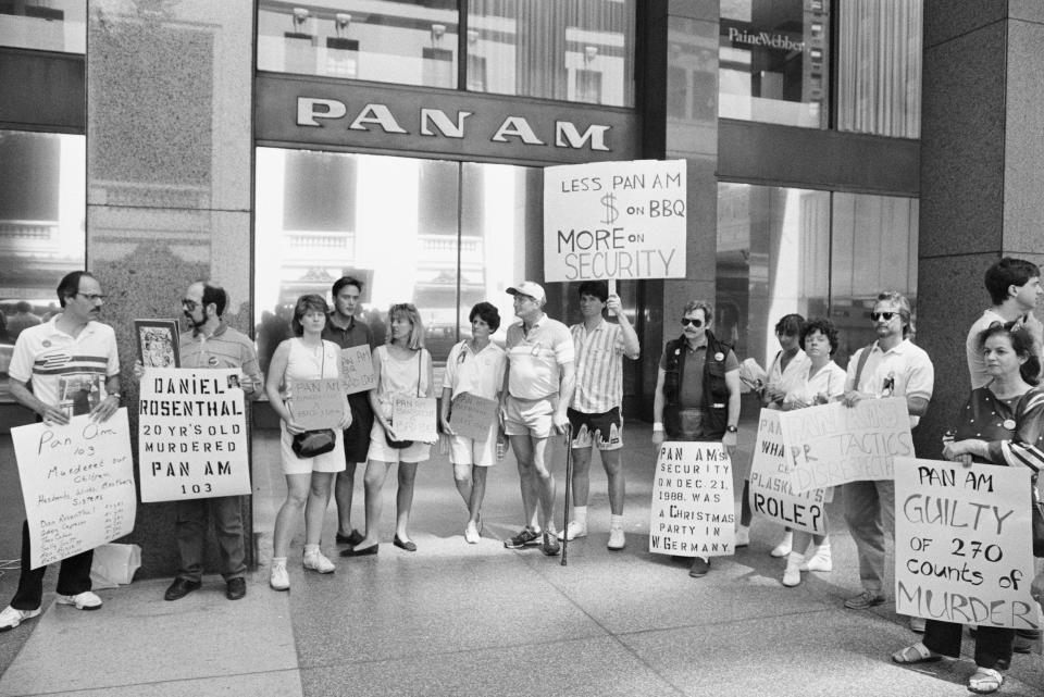Family members and friends of the victims of flight 103 protested in front of Pan Am headquarters after the airline sponsored a party on the site of the crash where their loved ones died.