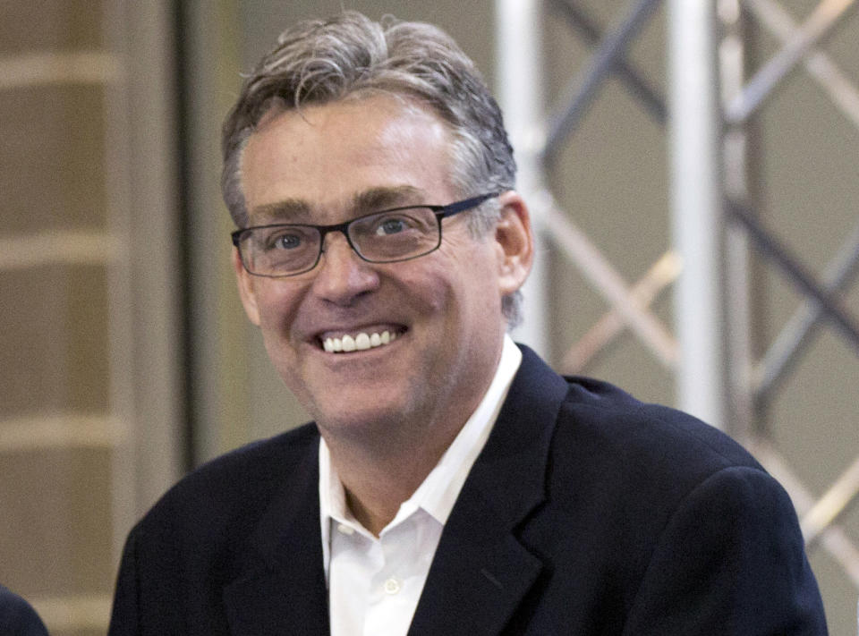 FILE - In this April 23, 2015, file photo, San Antonio Spurs general manager R.C. Buford smiles during an NBA basketball news conference in San Antonio. Buford has been named the NBA's executive of the year, the league announced Monday, May 9, 2016. It's the second time Buford has received the honor. He previously won it in the 2013-14 season. (AP Photo/Eric Gay, File)