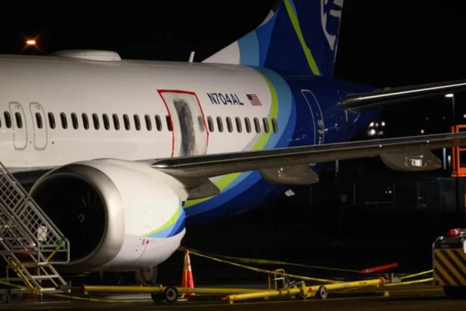 A plastic sheet covers an area of the fuselage of the Alaska Airlines N704AL Boeing 737 MAX 9 aircraft outside a hangar at Portland International Airport. This week, Sam Salehpour, who worked at Boeing for 17 years, told US lawmakers he first raised concern in 2020.   (Photo by Mathieu Lewis-Rolland/Getty Images)