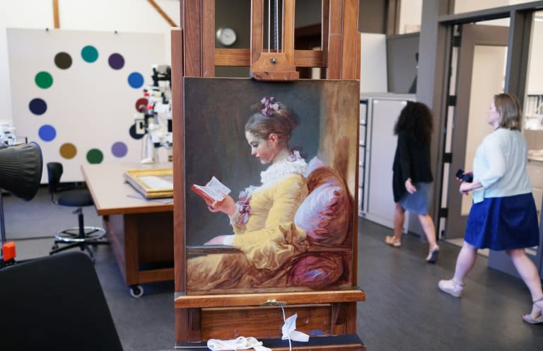 "Young Girl Reading" by Jean-Honore Fragonard is seen at the National Gallery of Art's painting conservation studio, where conservators examine and touch up other priceless works