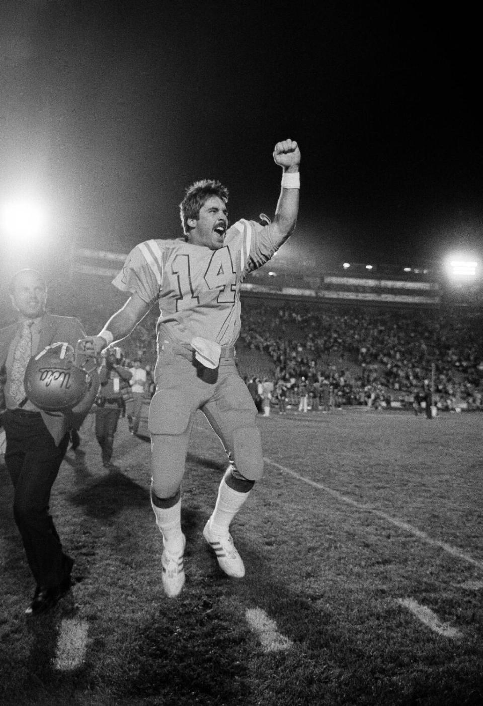 UCLA quarterback Tom Ramsey jumps for joy after leading his teammates to win over Michigan in the 1983 Rose Bowl.
