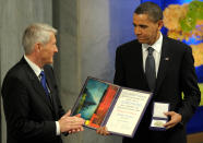 <p>President Barack Obama, right is applauded by Nobel Committee Chairman Thorbjorn Jagland after receiving the Nobel Peace Prize during a ceremony in the Main Hall of Oslo City Hall in Oslo, Norway, Thursday, Dec. 10, 2009. (AP Photo/Susan Walsh) </p>